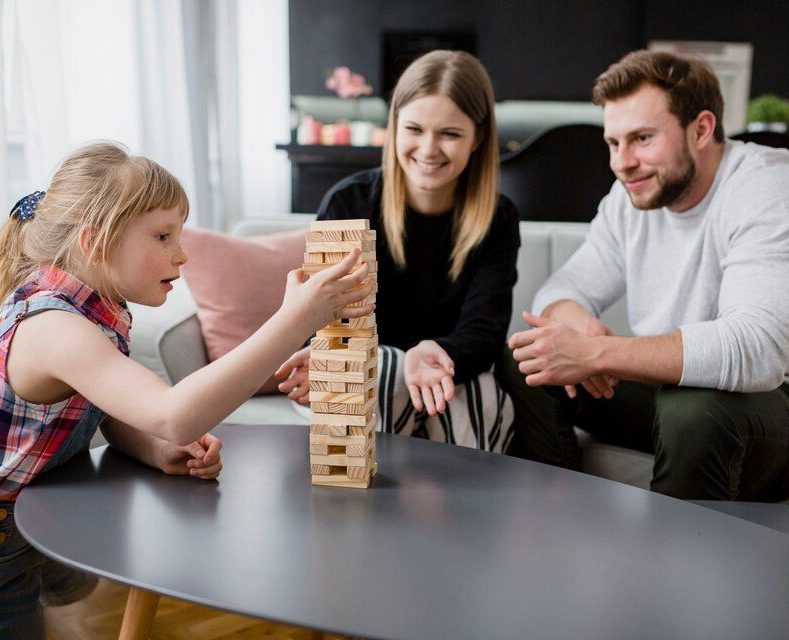 freepicdownloader.com-parents-looking-daughter-removing-blocks-large